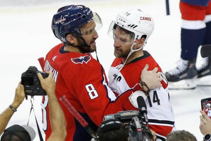 Washington Capitals left wing Alex Ovechkin congratulating Carolina Hurricanes right wing Justin Williams after the game in the 2019 Stanley Cup Playoffs at Capital One Arena
