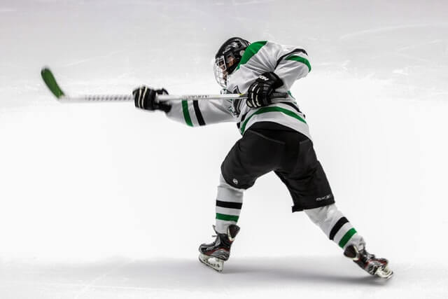 Hockey Player Shooting a Puck